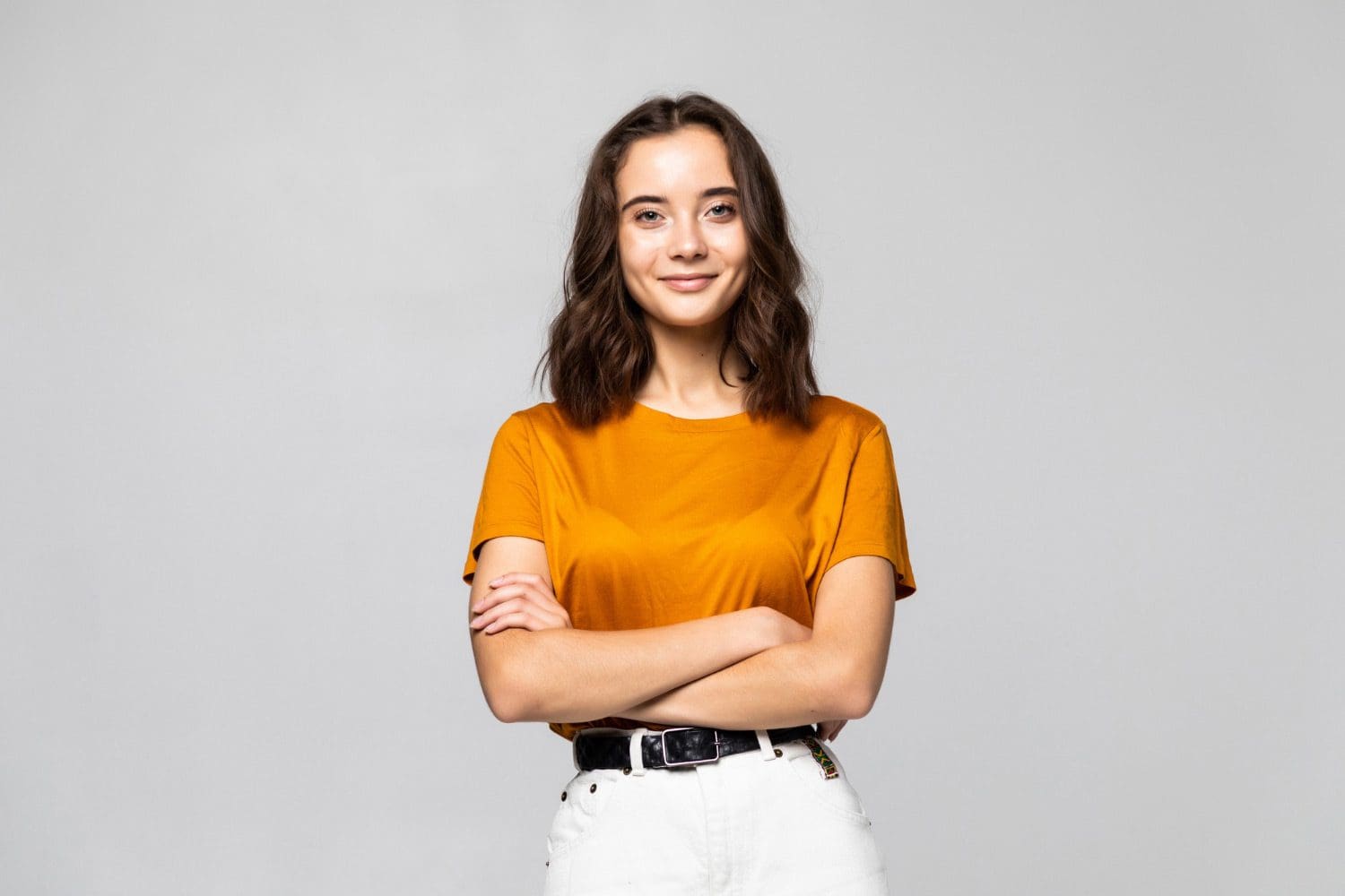 Portrait of a young woman standing in business casual attire