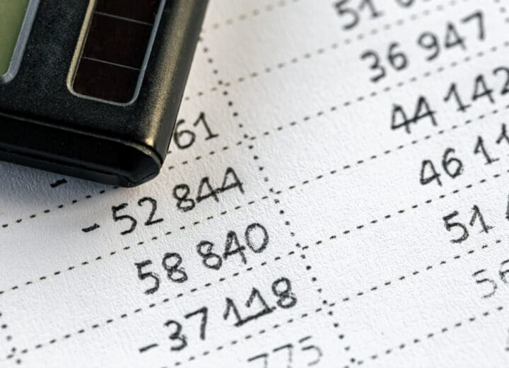 Close-up of a calculator and numbers on paper illustrating the current ratio formula concept